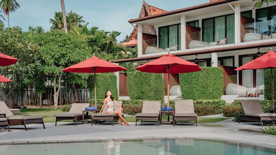 Loungers at Thai Village swimming pool Loungers at Thai Village swimming pool