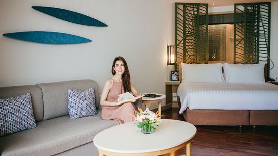 Living area and king bed in Junior Suite Ocean View Living area and king bed in Junior Suite Ocean View