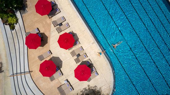 Loungers at swimming pool Loungers at swimming pool