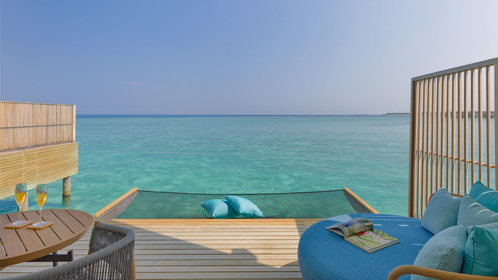 Terrace with daybed and hammock at Ocean Villa - Amari Raaya Maldives