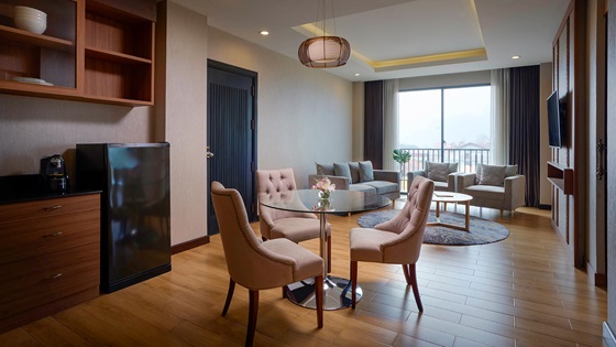 Separate living and dining room in One Bedroom Suite River View with Balcony - Amari Vang Vieng
